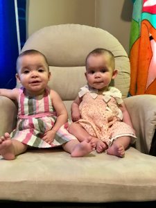 Abigail (left) and Autumn (right) Stadelman, granddaughters of Linda Barnicott, smile for their 9 month old photos.