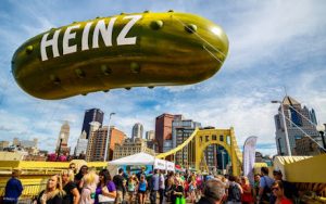 Photo of Picklesburgh with the city of Pittsburgh in the background.