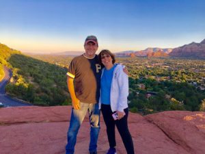 This image features Linda Barnicott with her husband, Tom, in the mountains of Sedona, Arizona.