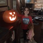 This image shows Aria, granddaughter of Linda Barnicott, with a pumpkin she carved.