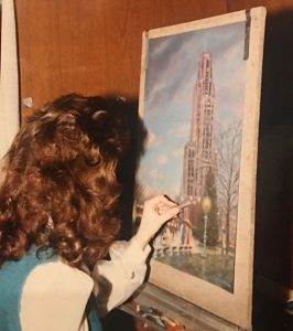 This image shows Linda Barnicott working on her painting "Walking In The Light of the Cathedral."